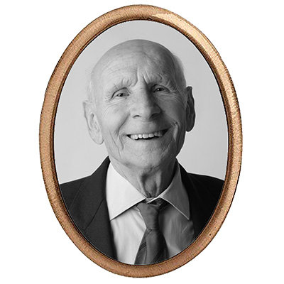 oval plaque with picture of old man