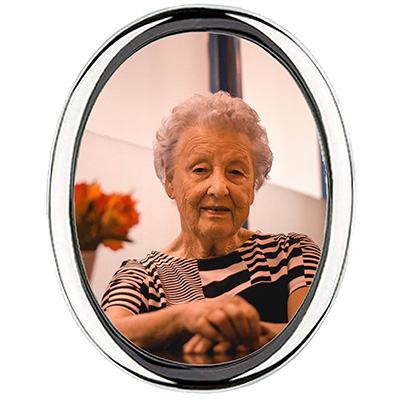 oval plaque with picture of old lady